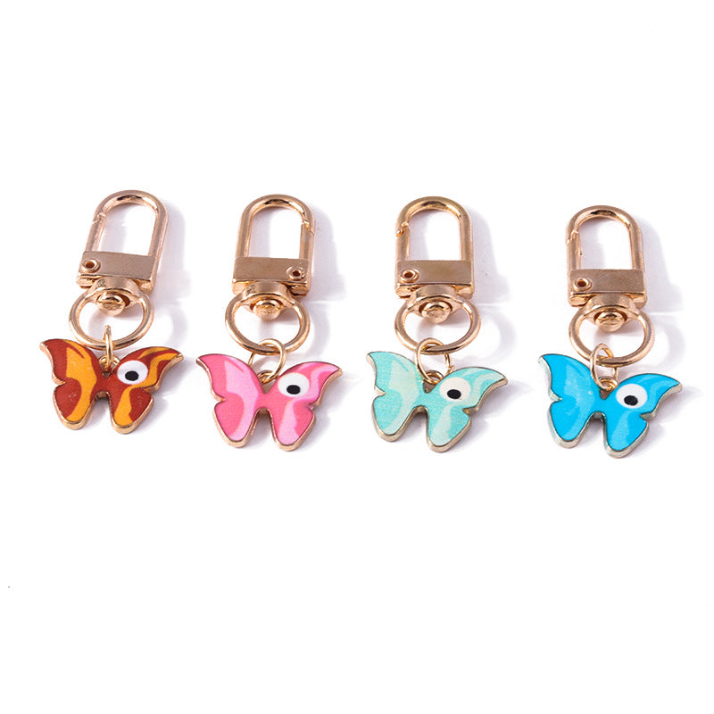 Wholesale Cartoon Butterfly Eyes Zinc Alloy Keychain